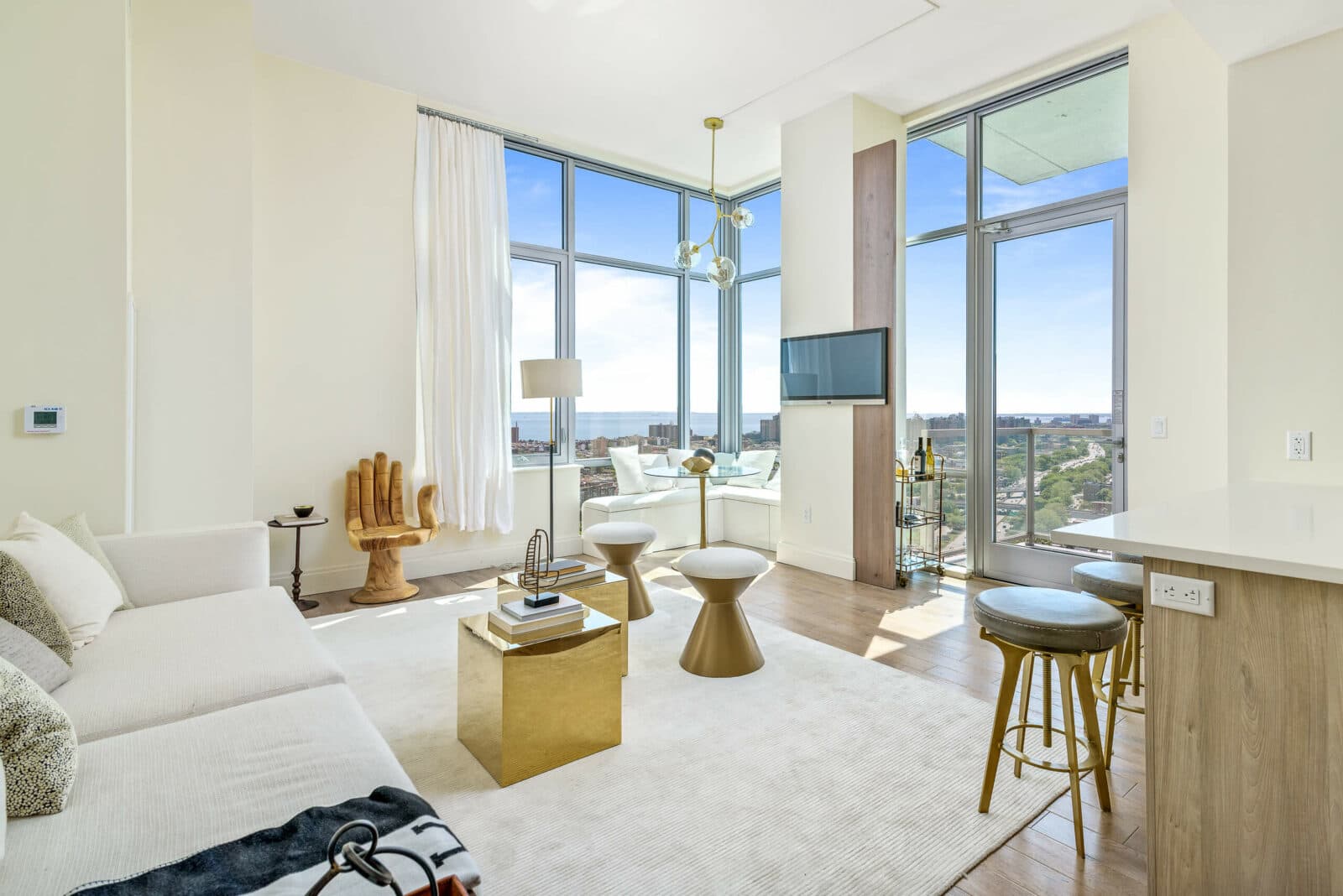 Well-lit NYC condo living room photographed for a premium real estate listing package