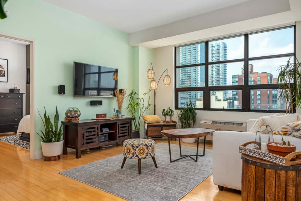 Photography of a living room with bedroom on a left side in real estate property in Long Island City Queens